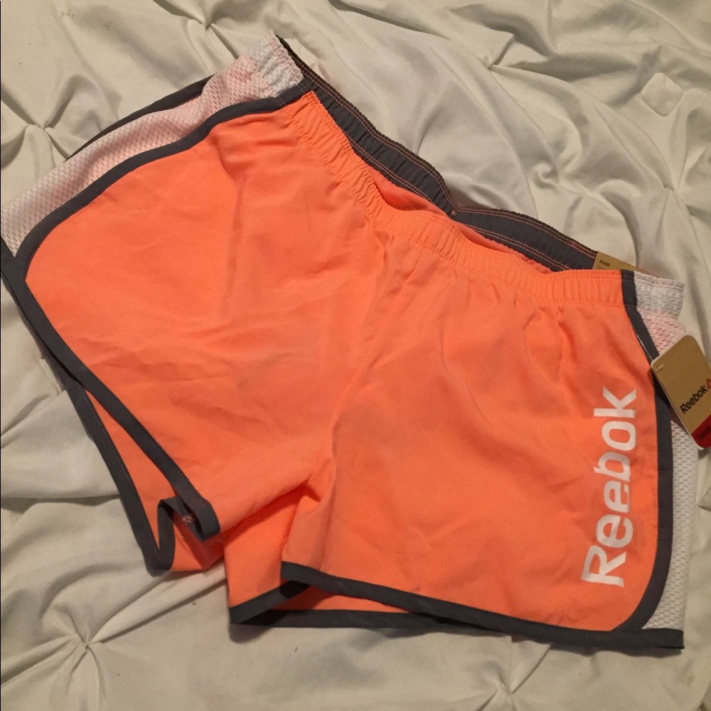 Neon coral Reebok shorts
